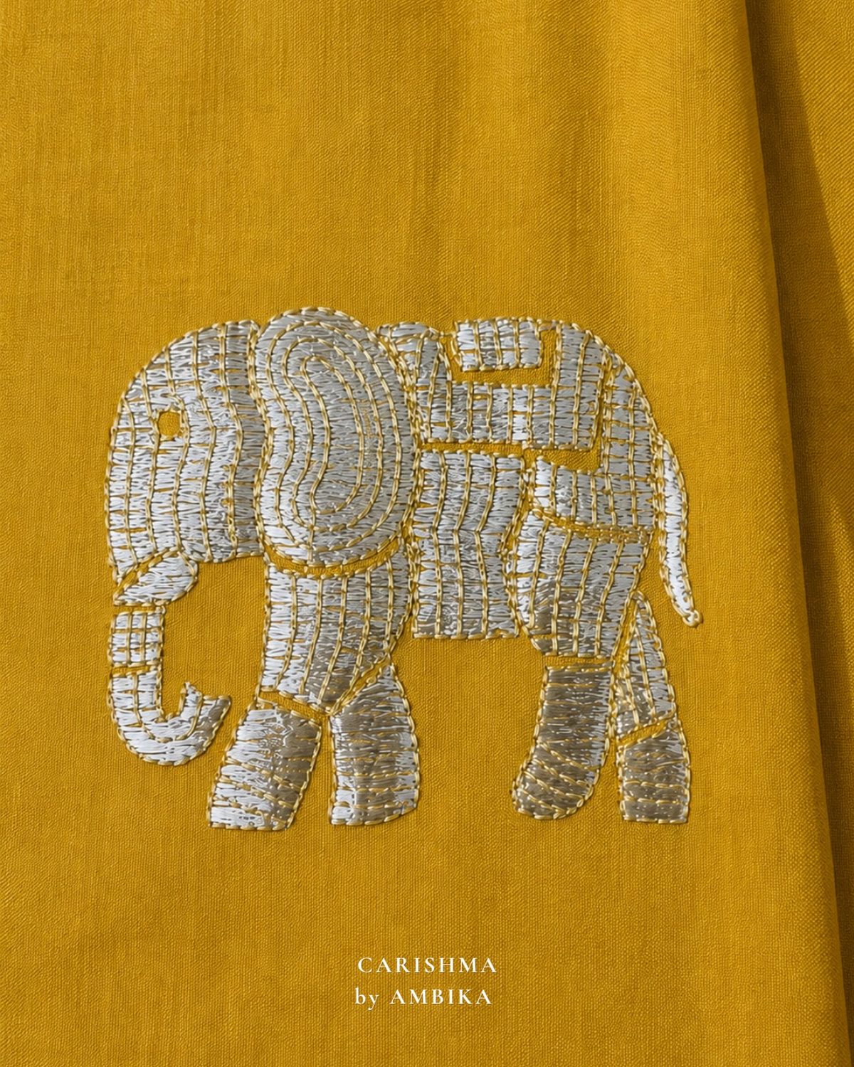 Elephant motif in silver sequins on mustard silk